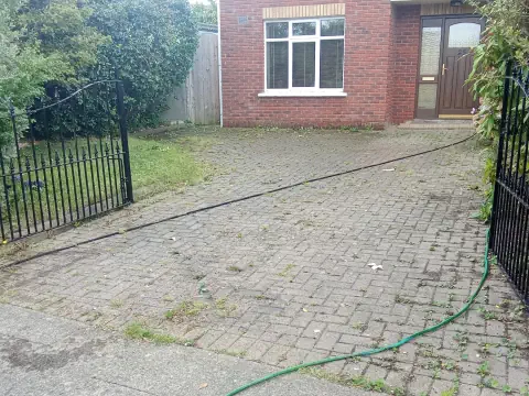 Paved driveway in Tramore before being professionally cleaned