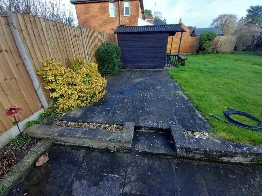 Natural stone paved patio cleanign in County Waterford before image